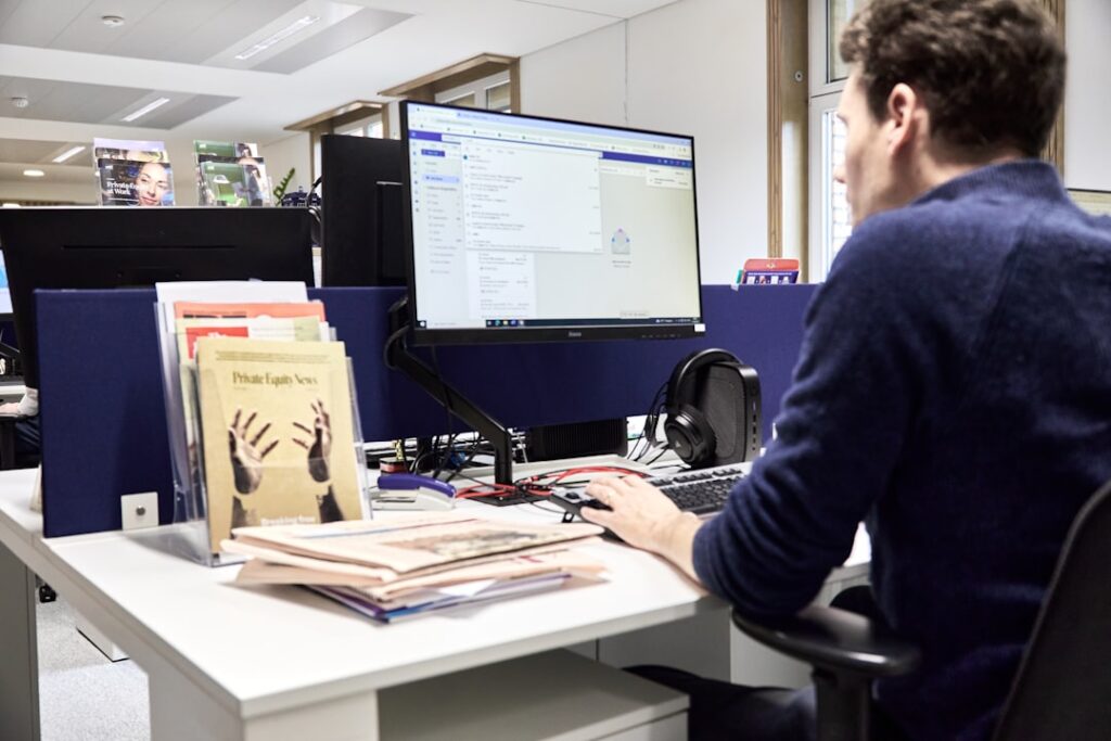 Hands inserting document into scanner