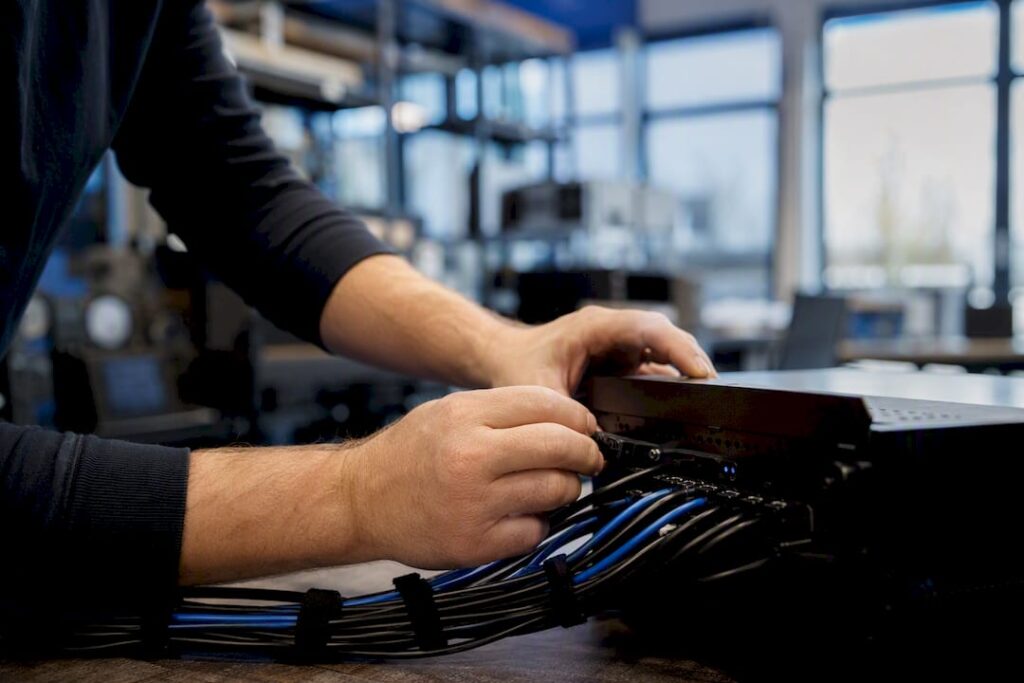 Hands adjusting AI knowledge management hardware