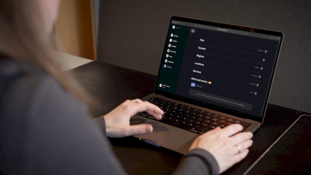 Hands adjusting compliance automation controls